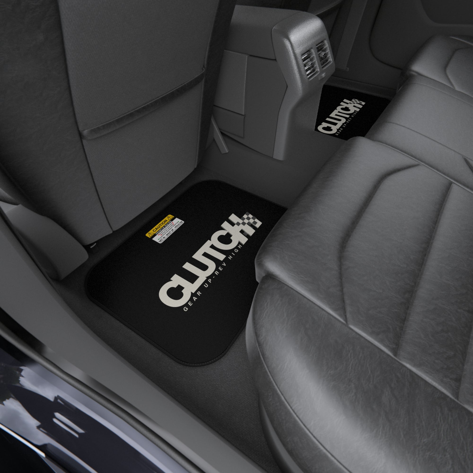 Clutch Car Mat Set – Rear Left Premium set of black car mats featuring the Clutch logo and "Gear Up, Rev High" tagline Displayed in the front seat of a car. Designed for durability and style, perfect for automotive enthusiasts.