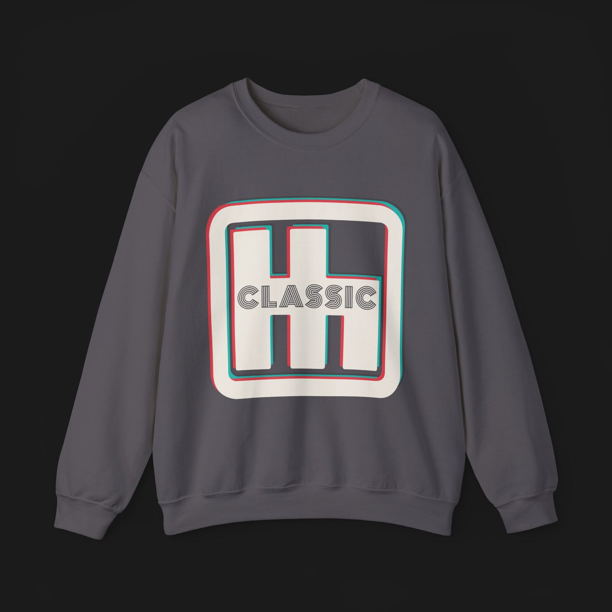 Front of Clutch Classic Automotive Graphic Crewneck – Grey unisex crewneck sweater featuring a retro 'Clutch' logo with a bold outlined design in red, blue, and white. Perfect for car enthusiasts and casual wear.
