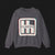 Front of Clutch Classic Automotive Graphic Crewneck – Grey unisex crewneck sweater featuring a retro 'Clutch' logo with a bold outlined design in red, blue, and white. Perfect for car enthusiasts and casual wear.