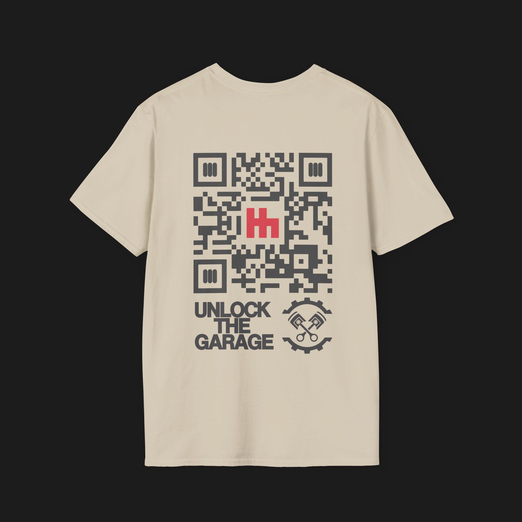 Back of Clutch Classic Unlock The Garage Automotive Graphic T-Shirt – sand tee featuring a small "Clutch Automotive Apparel" chest design. Perfect gift for car lovers and gearheads.