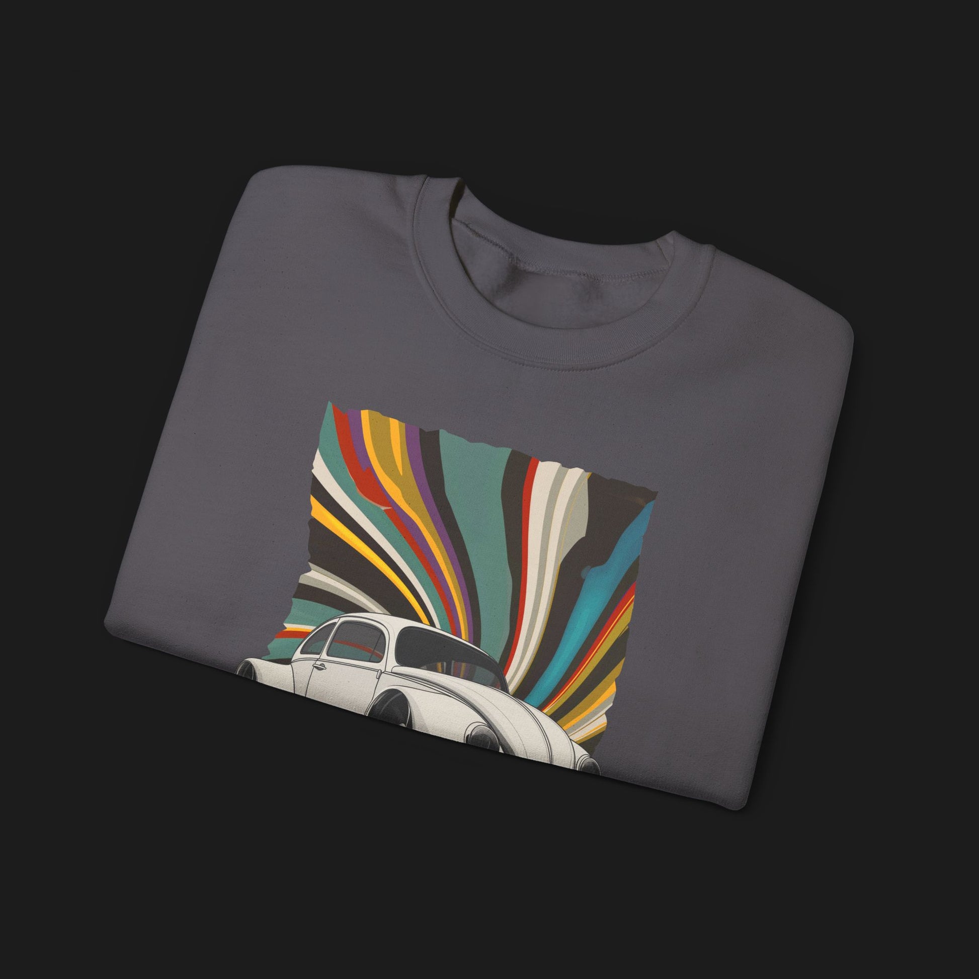 Folded Vintage Goods Bug Automotive Graphic Crewneck – Grey unisex sweater featuring a classic Volkswagen Beetle with a colorful retro swirl background. Ideal for vintage car enthusiasts and retro style lovers.