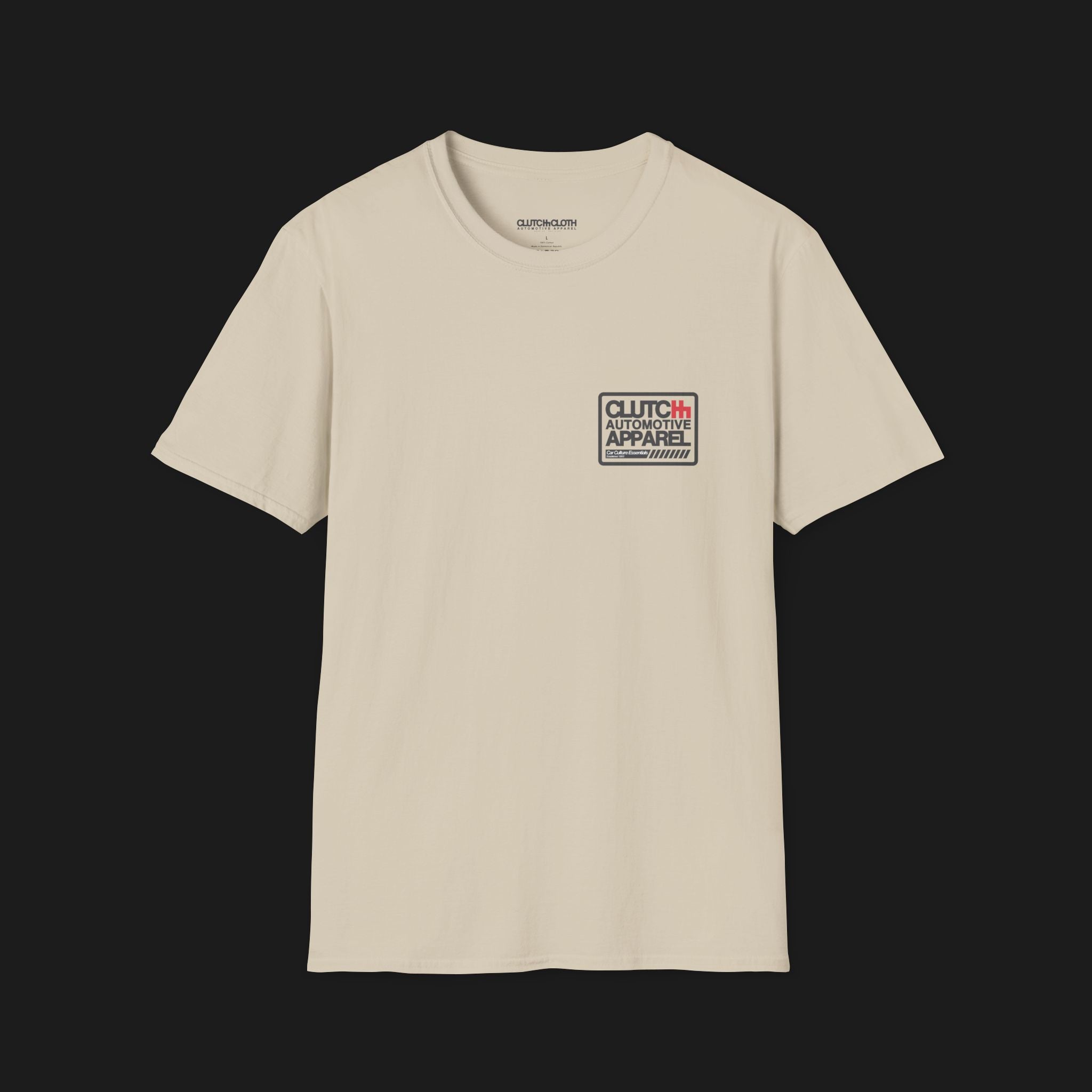 Front angle of Clutch Classic Unlock The Garage Automotive Graphic T-Shirt – sand tee featuring a small "Clutch Automotive Apparel" chest design. Perfect gift for car lovers and gearheads.