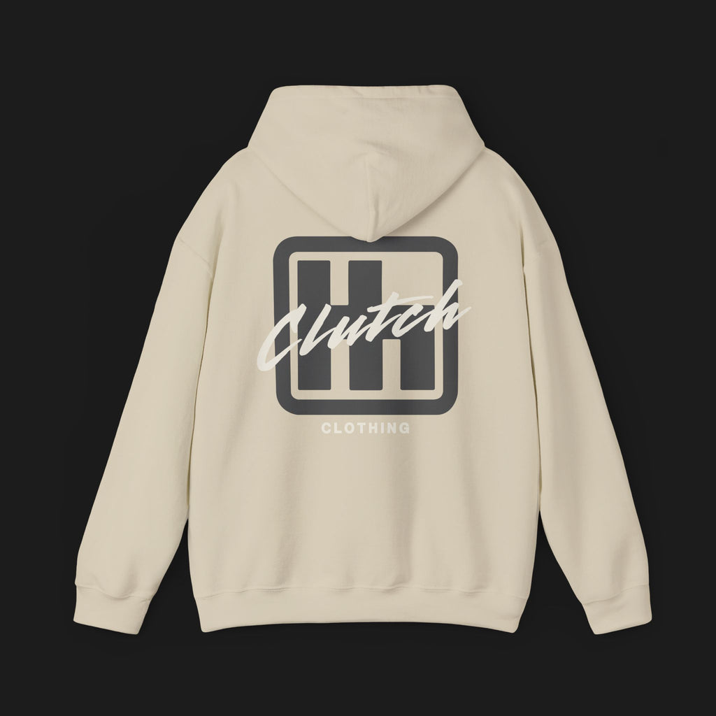 Back of Clutch Clothing Unisex Automotive Graphic Hoodie – Beige hoodie featuring a bold 'Clutch' logo with a stylized 'H' shifter design and script text overlay. Ideal for car enthusiasts and casual streetwear."