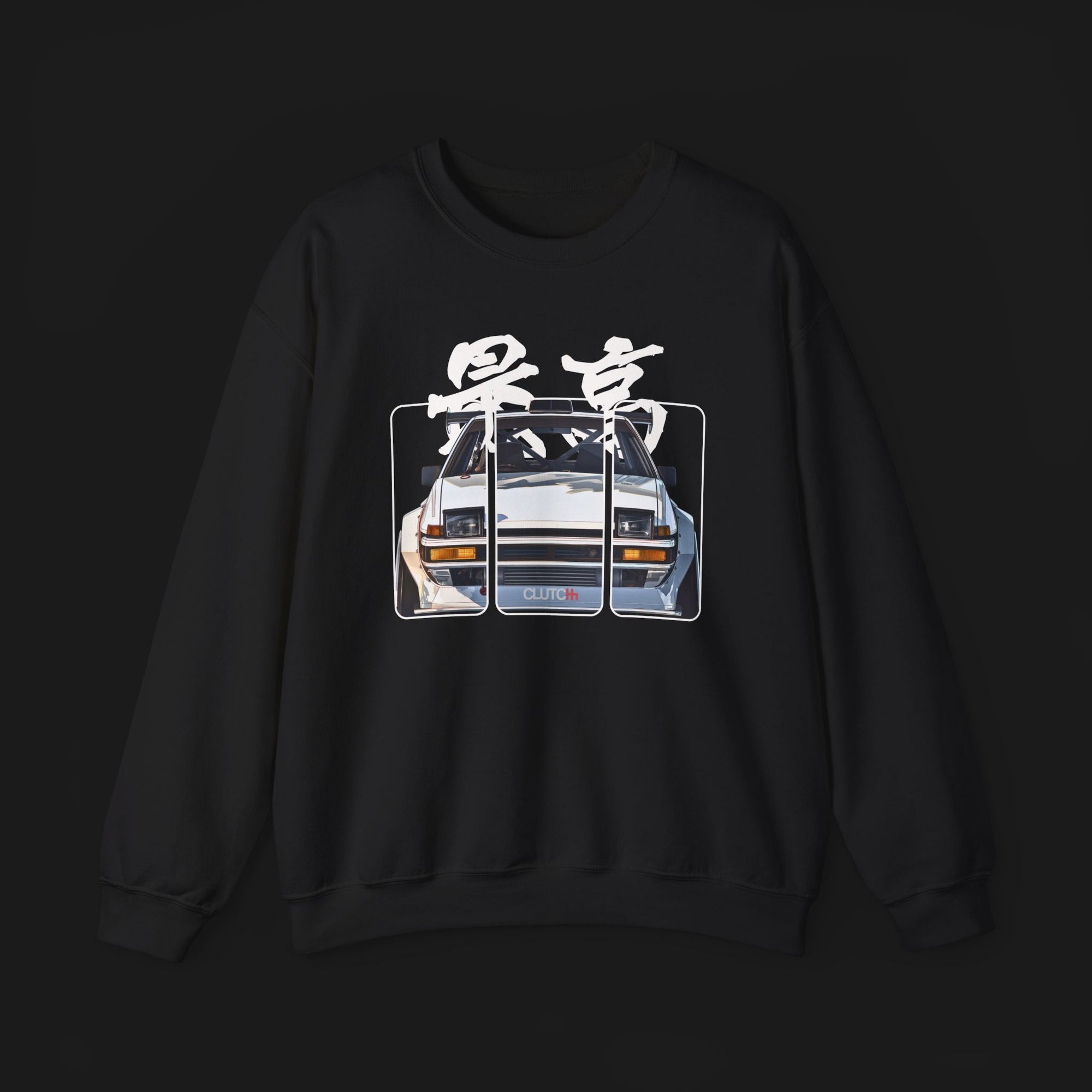 Front of AE86 Automotive Graphic Crewneck – Black unisex crewneck sweater featuring a front graphic of a white AE86 car with red Japanese text background design. Perfect for JDM enthusiasts and car lovers.