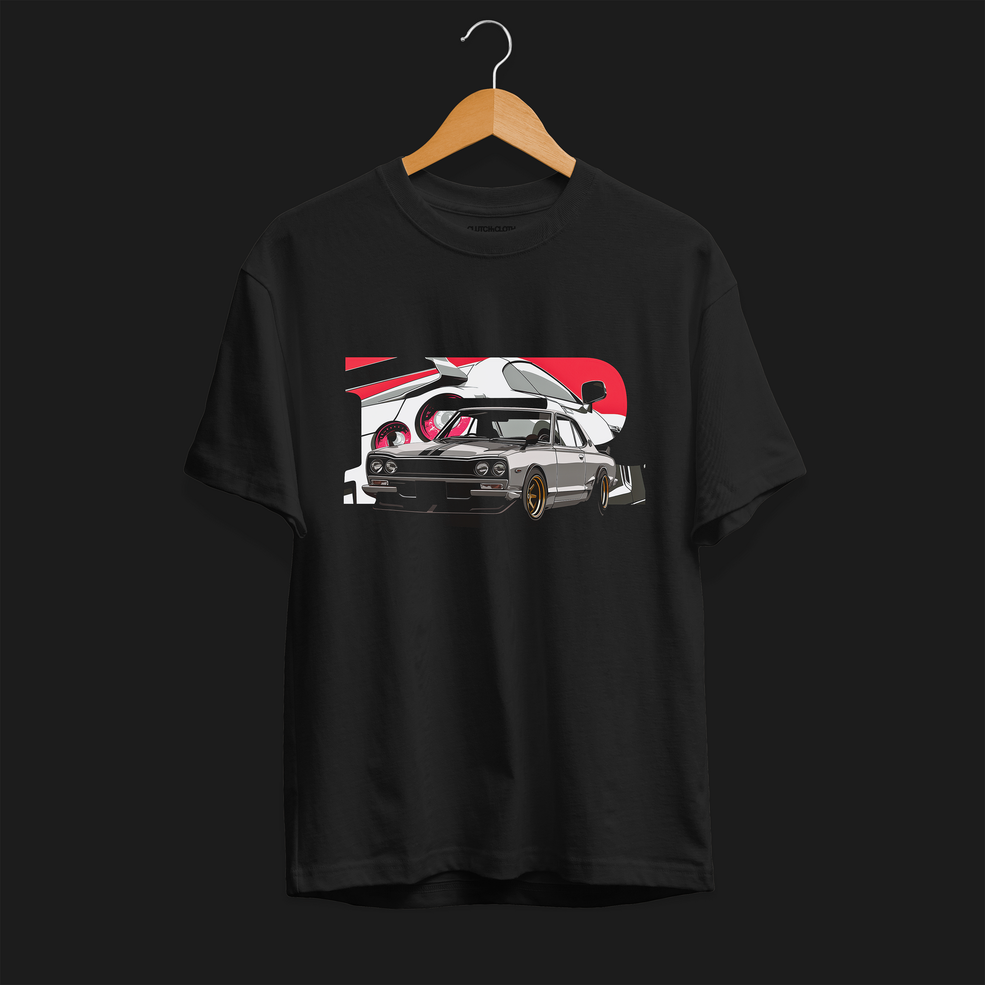 Front of 1970 2000GT-R Fuji Speedway Heritage Automotive Graphic T-Shirt – Black unisex tee featuring a classic 1970 2000GT-R in front of a stylized Fuji Speedway background in red and white. Ideal gift for vintage car enthusiasts and JDM lovers.