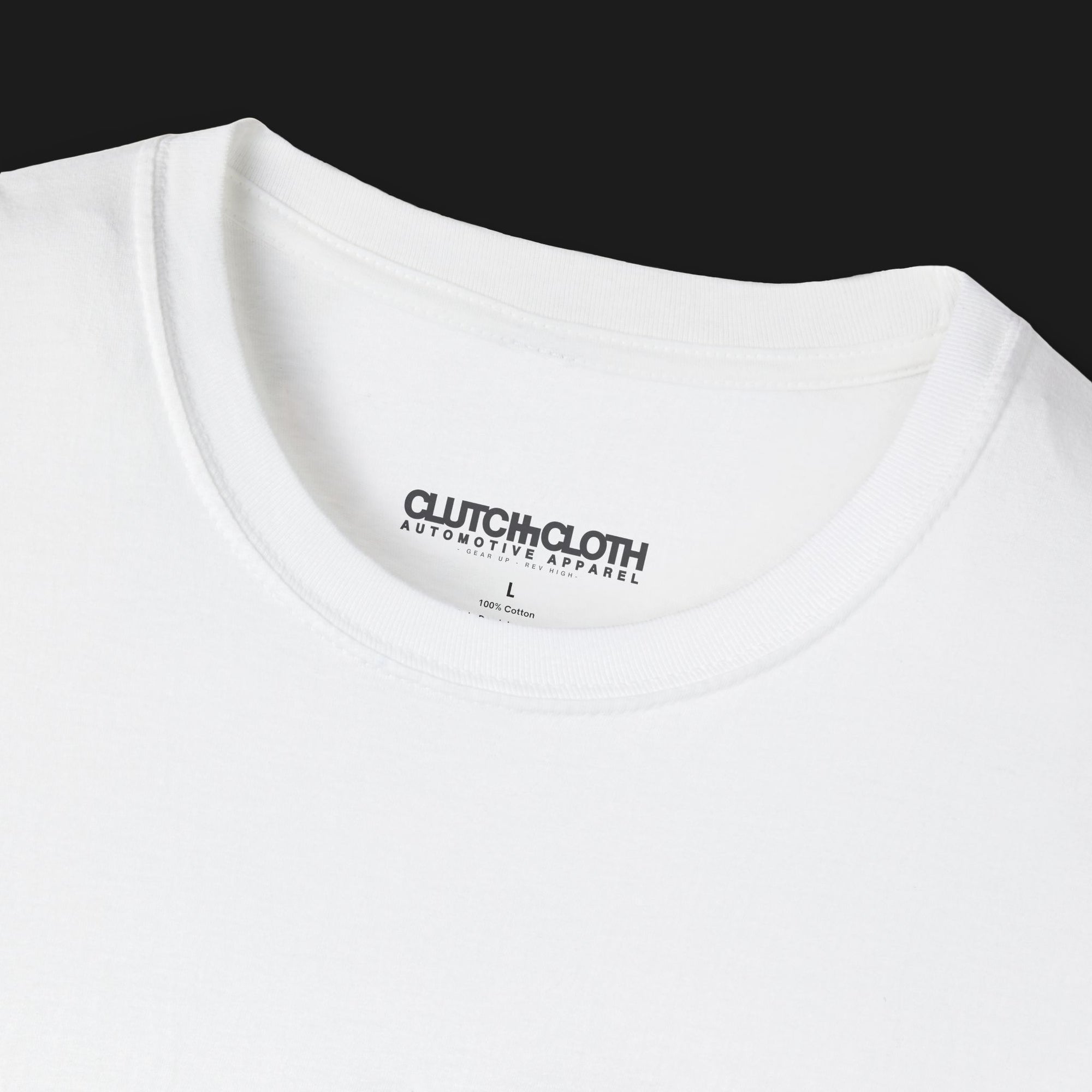 collar of Clutch Classic Unlock The Garage Automotive Graphic T-Shirt – White tee featuring a small "Clutch Automotive Apparel" chest design. Perfect gift for car lovers and gearheads.