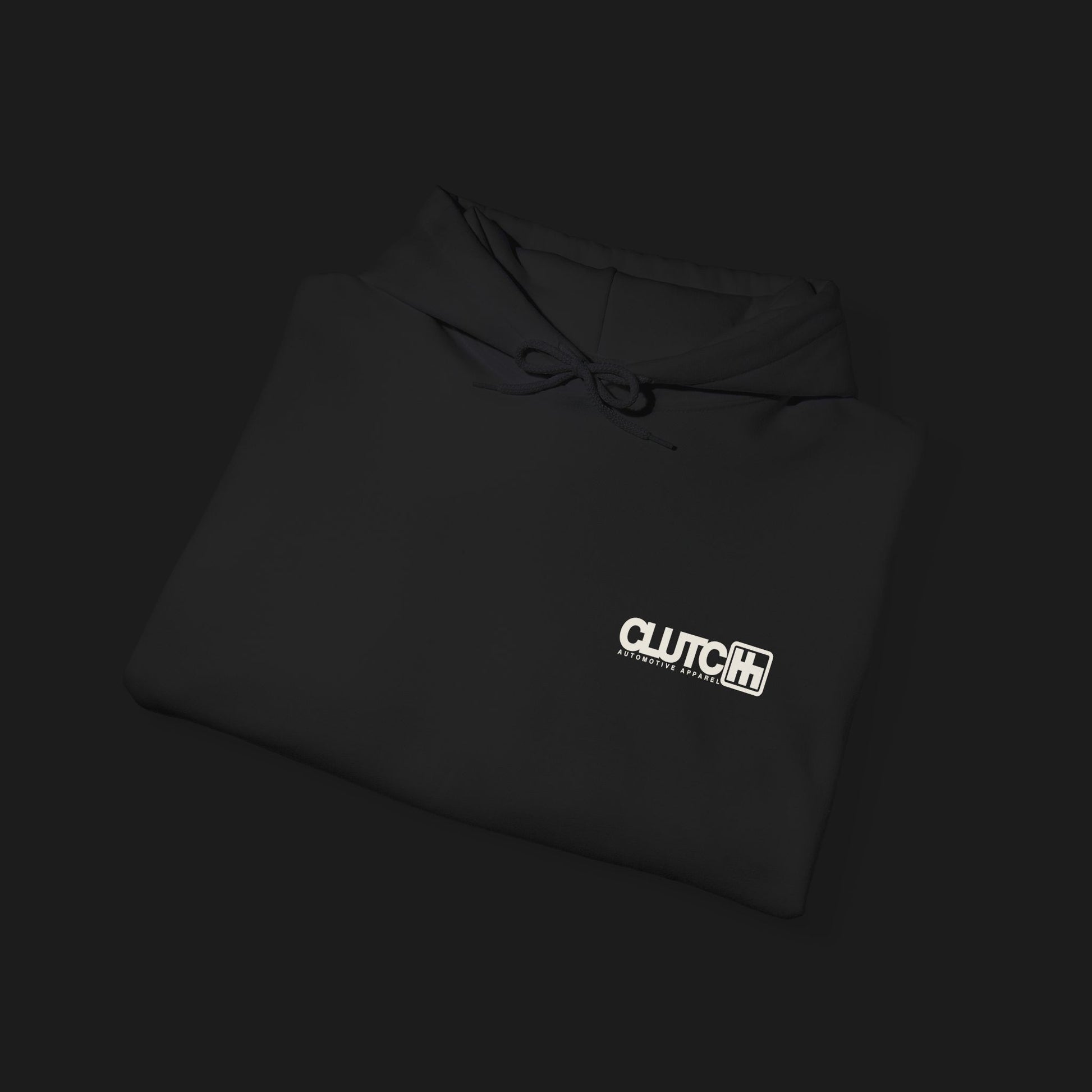 Folded front Clutch Clothing Unisex Automotive Graphic Hoodie – Black hoodie featuring a bold 'Clutch' logo with a stylized 'H' shifter design and script text overlay. Ideal for car enthusiasts and casual streetwear."