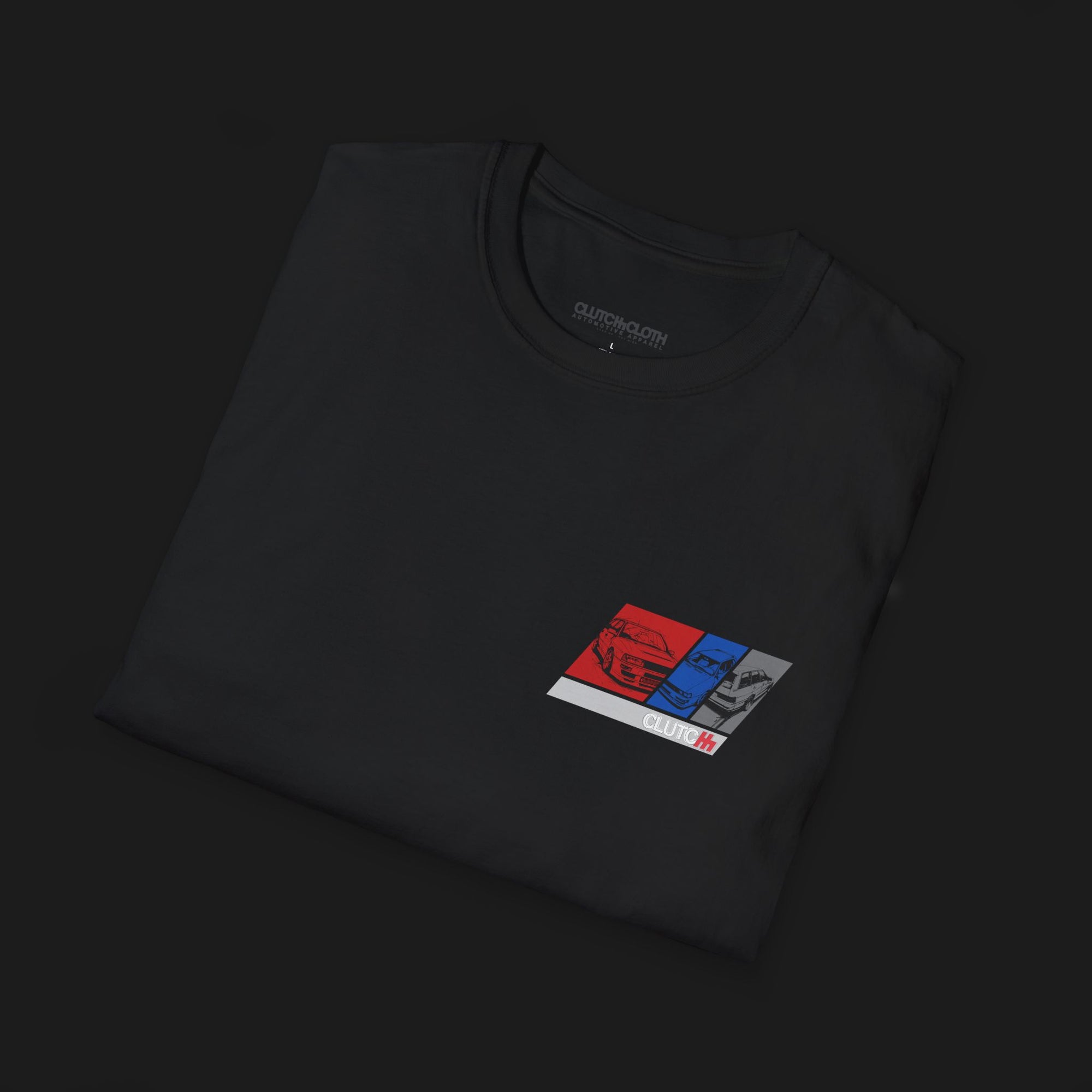 Folded RS2 Heritage Automotive Graphic T-Shirt – Black unisex tee featuring a stylish RS2 car design with red, white, and blue color blocks. Ideal gift for classic car enthusiasts and Audi fans.