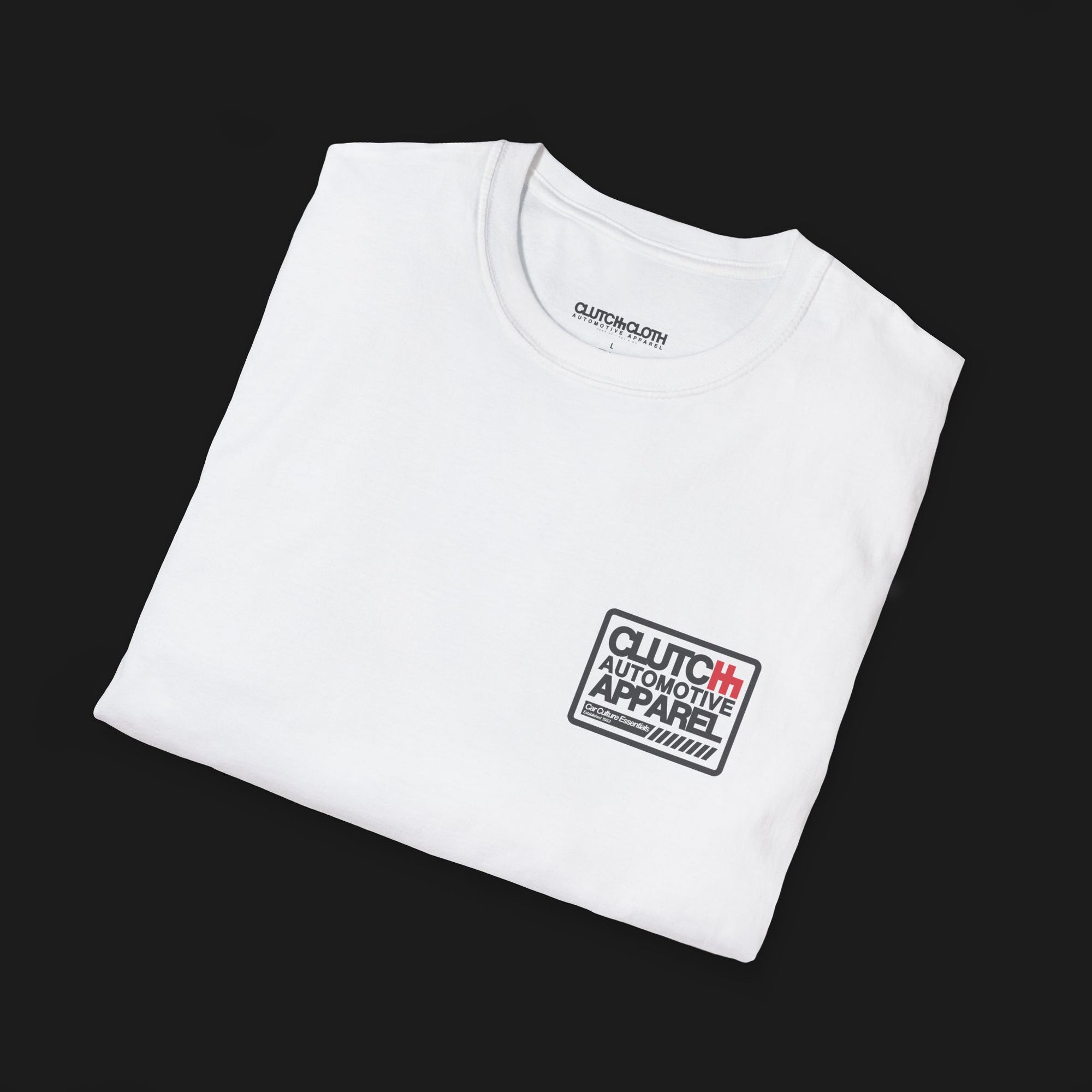 Folded Clutch Classic Unlock The Garage Automotive Graphic T-Shirt – White tee featuring a small "Clutch Automotive Apparel" chest design. Perfect gift for car lovers and gearheads.
