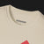 Collar of 911 GT-R Nemesis, Forever Rivals Automotive Graphic T-Shirt – Sand unisex tee featuring a front-facing Porsche 911 and GT-R graphic with a red geometric background. Perfect gift for car enthusiasts and JDM fans.