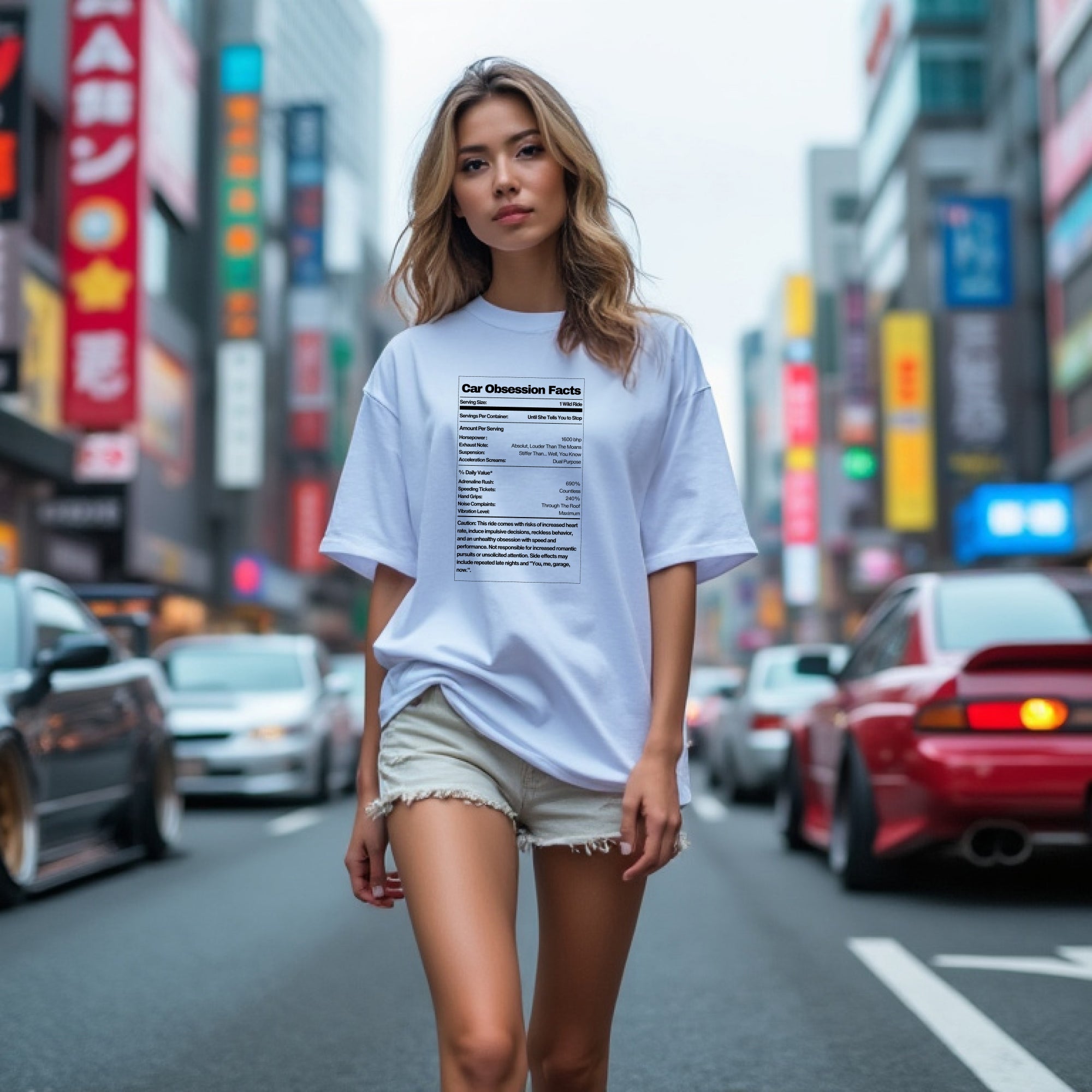 Woman wearing Car Obsession Facts Automotive Graphic T-Shirt – White unisex tee featuring a humorous 'Car Obsession Facts' label with details on horsepower, speed, and side effects. Ideal gift for car lovers and automotive enthusiasts.