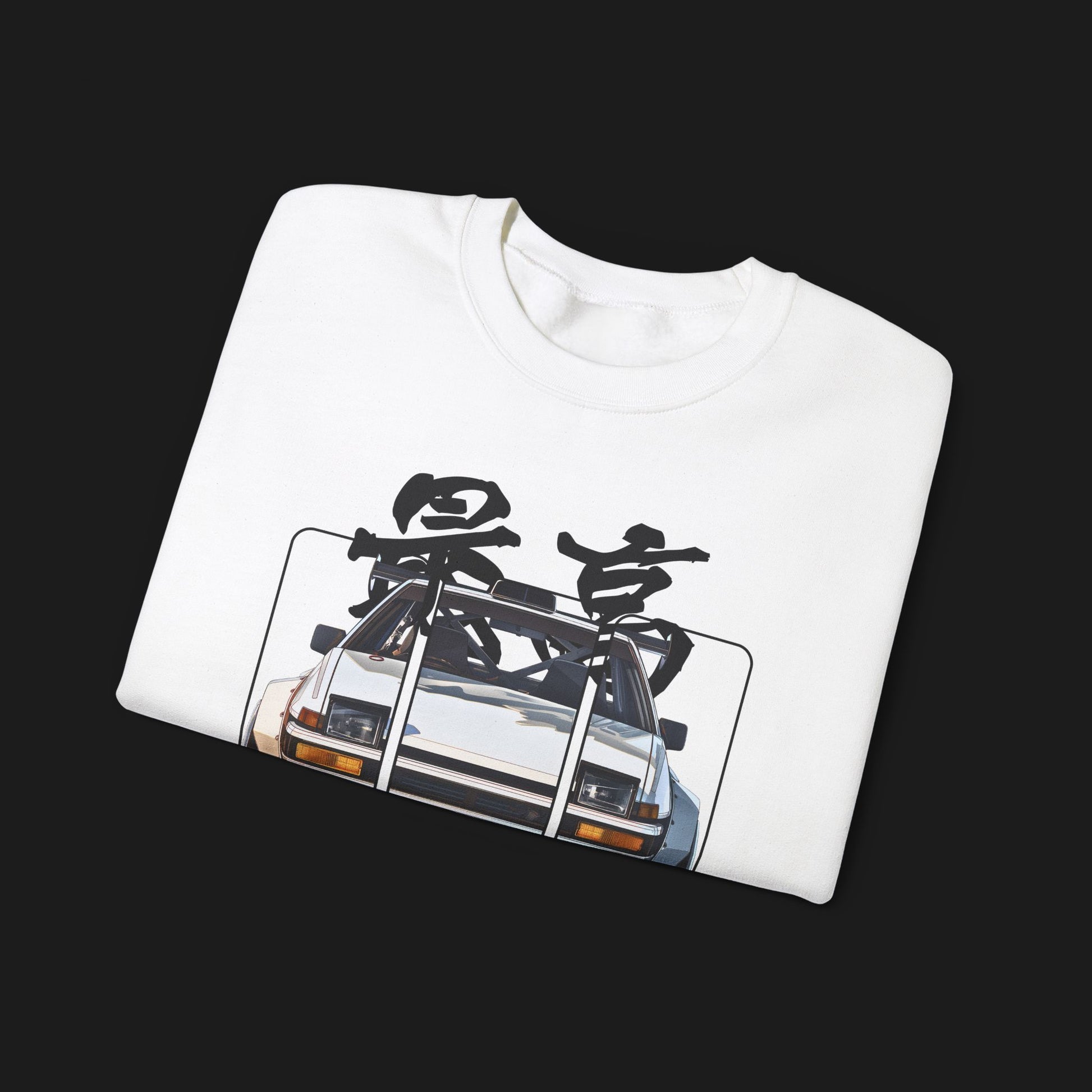 Folded AE86 Automotive Graphic Crewneck – White unisex crewneck sweater featuring a front graphic of a white AE86 car with red Japanese text background design. Perfect for JDM enthusiasts and car lovers.