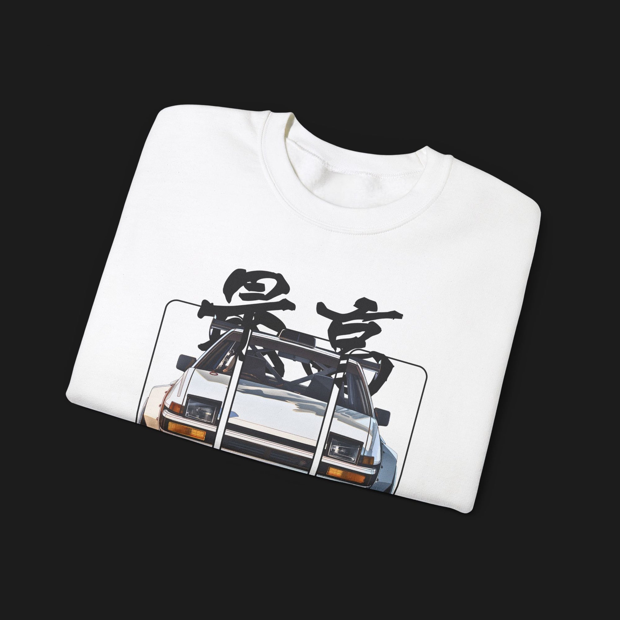 Folded AE86 Automotive Graphic Crewneck – White unisex crewneck sweater featuring a front graphic of a white AE86 car with red Japanese text background design. Perfect for JDM enthusiasts and car lovers.