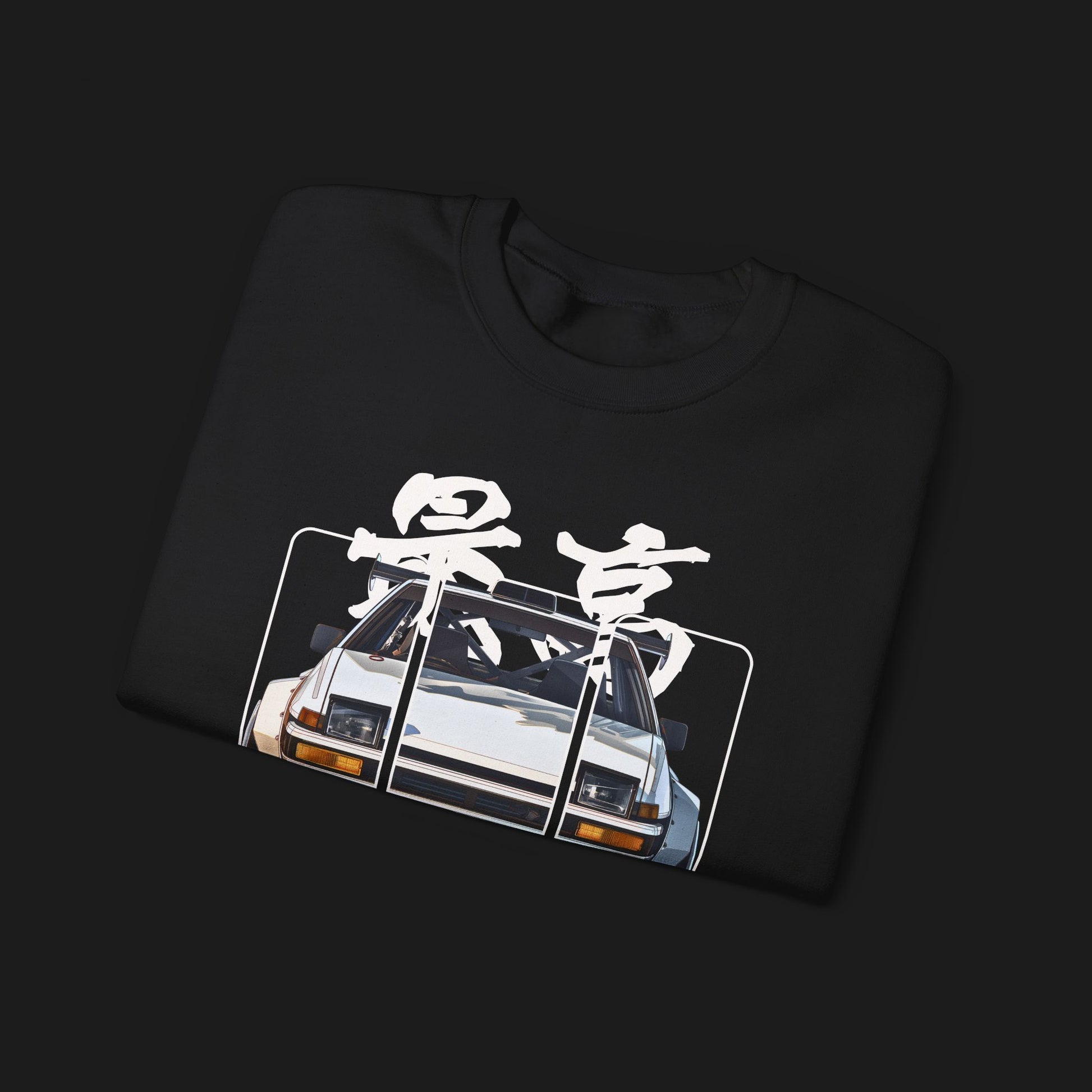 Folded AE86 Automotive Graphic Crewneck – Black unisex crewneck sweater featuring a front graphic of a white AE86 car with red Japanese text background design. Perfect for JDM enthusiasts and car lovers.