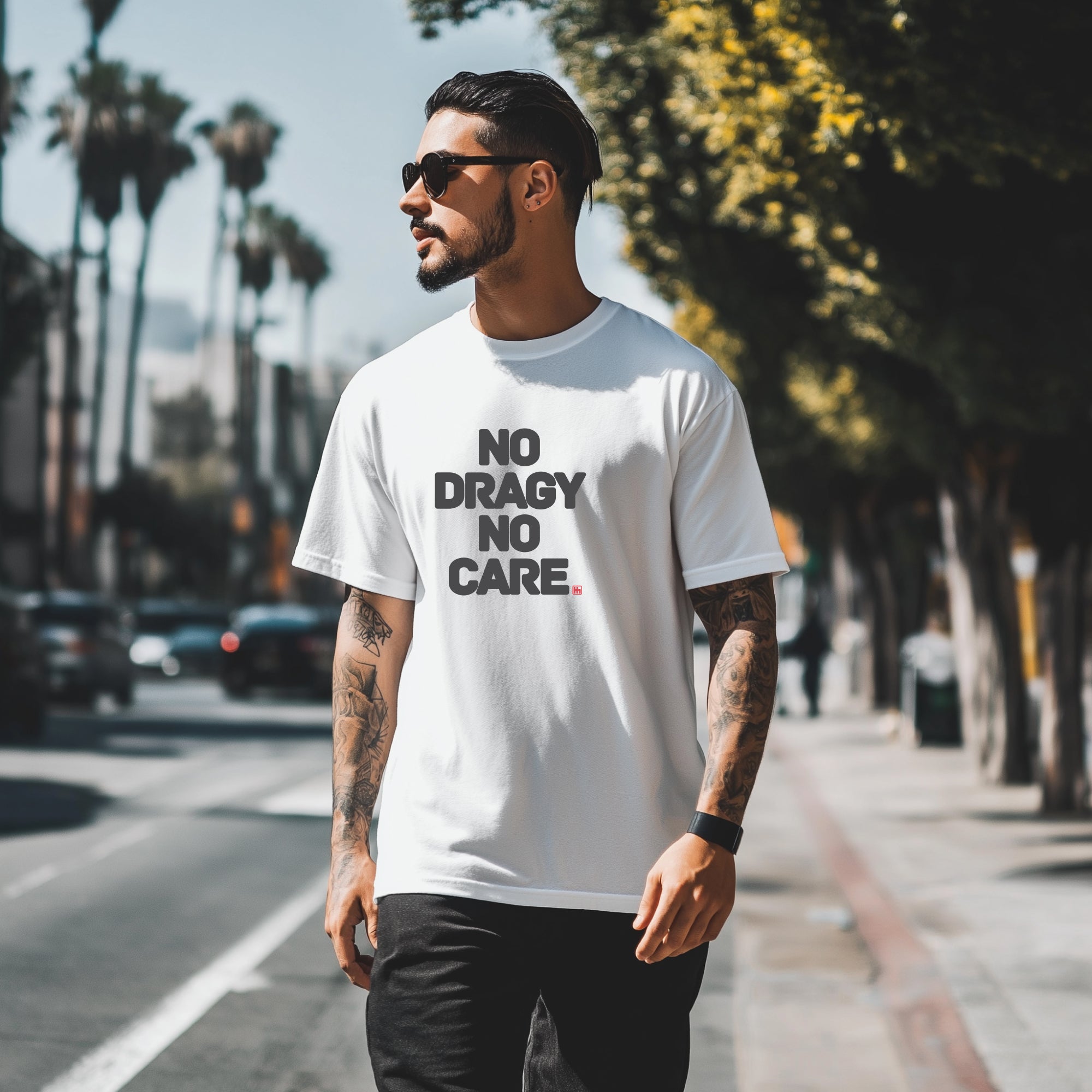 Man wearing No Dragy No Care Automotive Graphic T-Shirt – White tee with bold "No Dragy No Care" text design in black. Ideal gift for car culture fans and automotive enthusiasts.