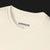 Astonishingly Overkill Automotive Graphic T-Shirt Collar – Beige tee featuring a bold Audi Quattro rally car design with a yellow overlay and "Astonishingly Overkill" text. Perfect gift for rally fans and car enthusiasts.
