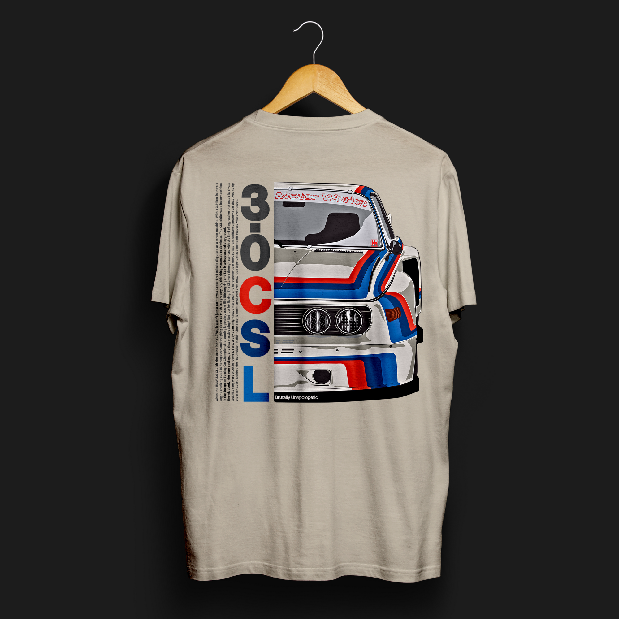 Brutally Unapologetic 30CSL Automotive Graphic T-Shirt – Back of Sand tee featuring a detailed front design of the iconic BMW 30CSL with red, blue, and white racing stripes. Perfect gift for BMW fans and car enthusiasts.