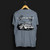 Back angle of Cobro x Clutch Automotive Graphic T-Shirt – Blue tee featuring a detailed white Mustang Cobra design with graffiti-style background and "Cobro" text. Perfect gift for Mustang fans and car enthusiasts.