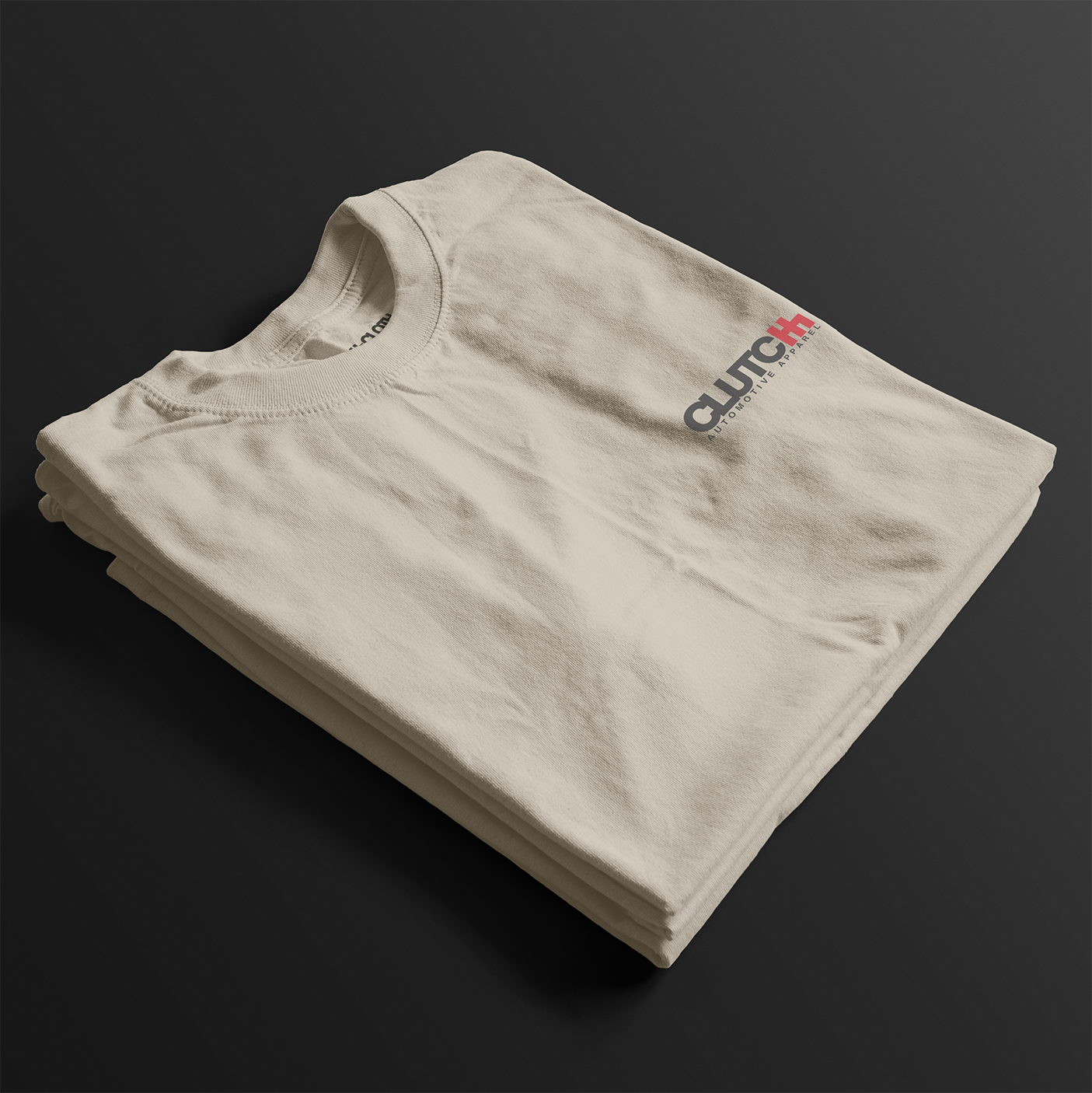Folded Cobro x Clutch Automotive Graphic T-Shirt – Sand tee featuring a detailed white Mustang Cobra design with graffiti-style background and "Cobro" text. Perfect gift for Mustang fans and car enthusiasts.