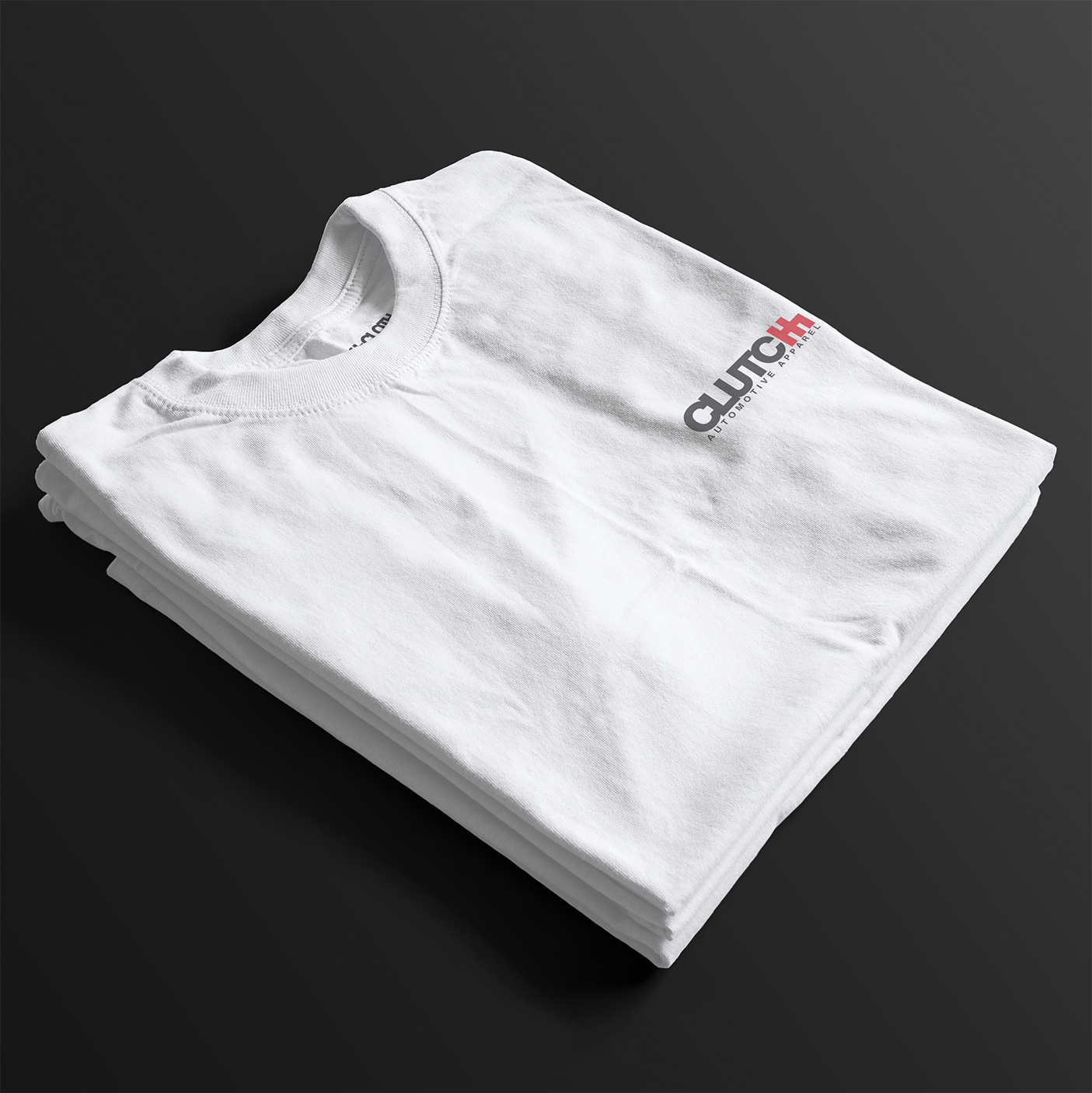 Folded Cobro x Clutch Automotive Graphic T-Shirt – White tee featuring a detailed white Mustang Cobra design with graffiti-style background and "Cobro" text. Perfect gift for Mustang fans and car enthusiasts.