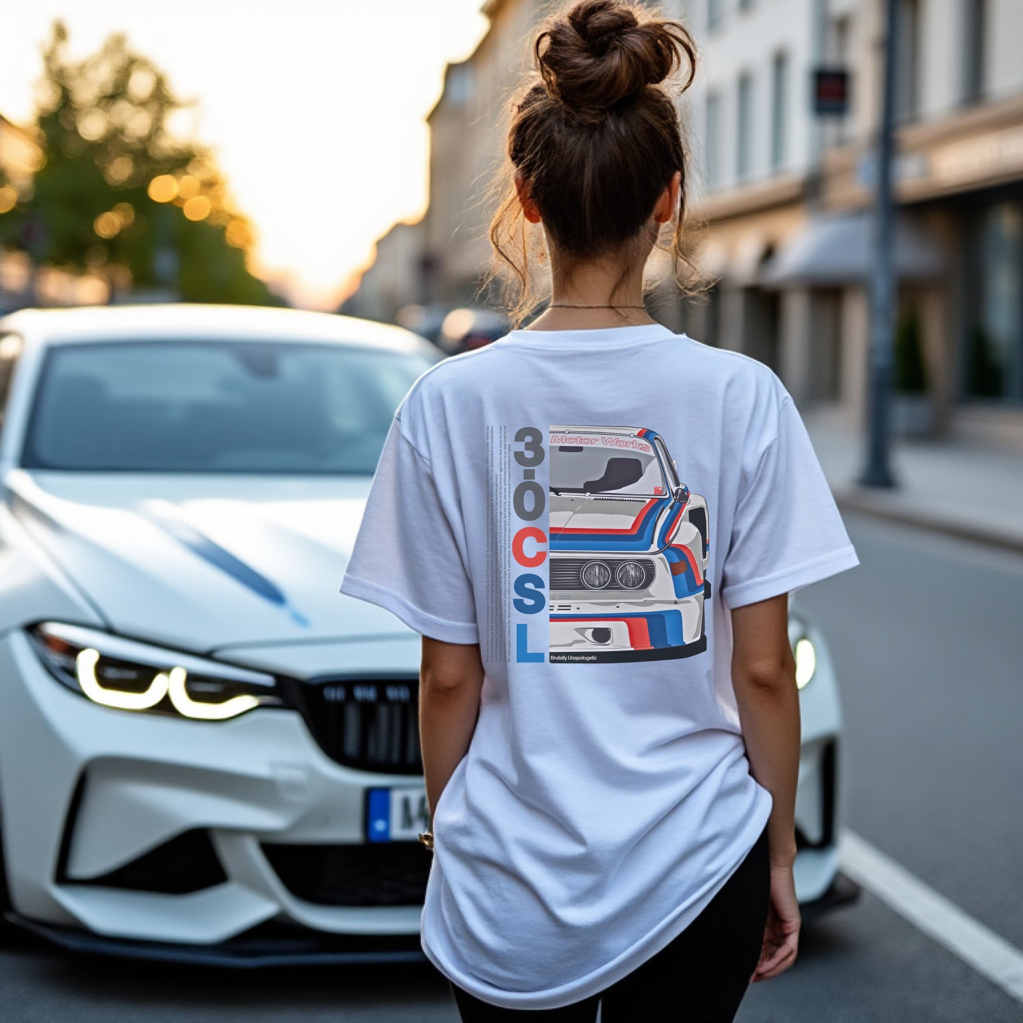 Brutally Unapologetic 30CSL Automotive Graphic T-Shirt – White tee featuring a detailed front design of the iconic BMW 30CSL with red, blue, and white racing stripes. Perfect gift for BMW fans and car enthusiasts.