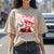 Woman wearing NSX Travel Penguin Automotive Graphic T-Shirt – Sand tee featuring an NSX sports car with Japanese travel-inspired artwork and a penguin character. Perfect gift for JDM fans and car enthusiasts.