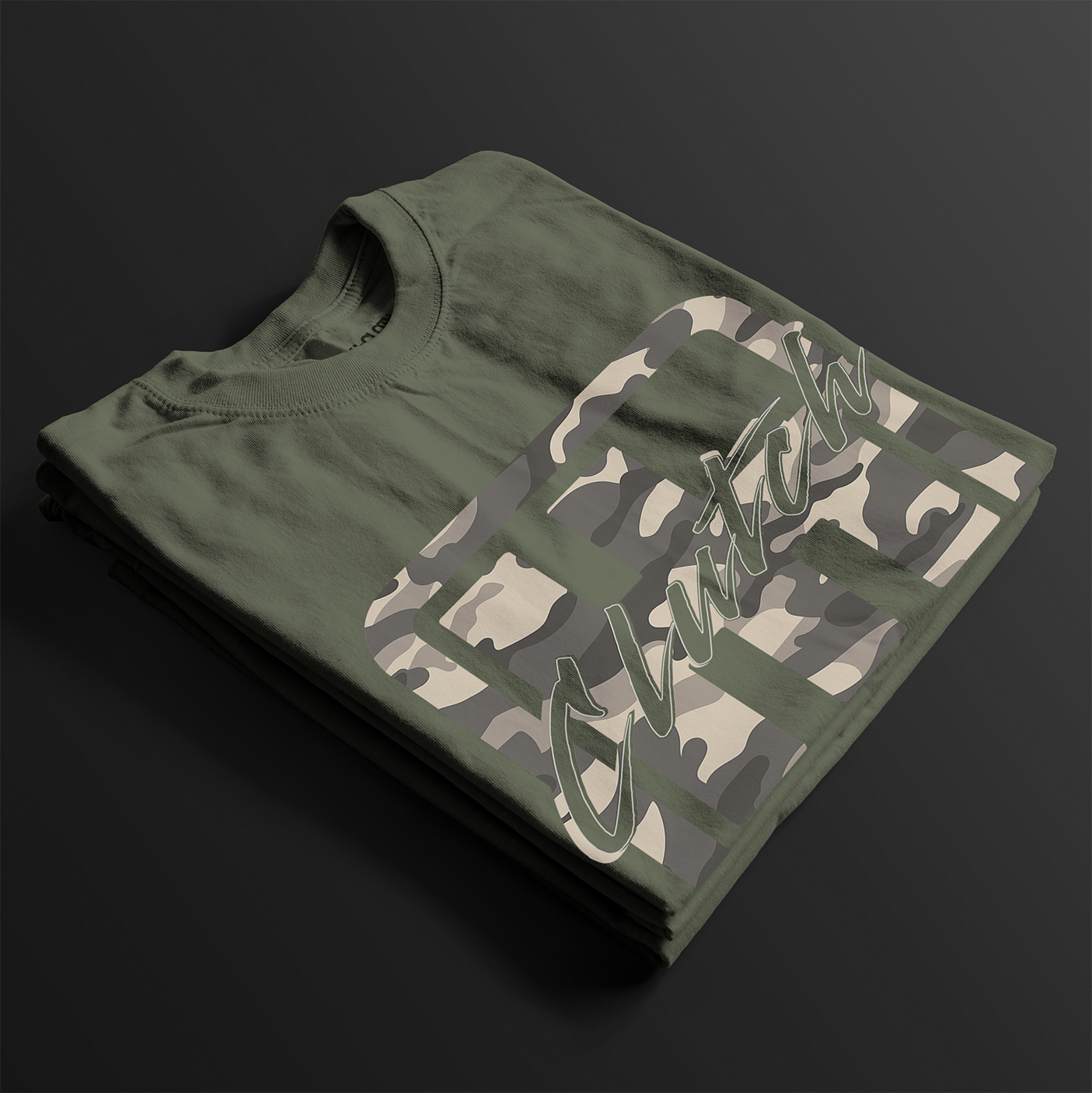 Clutch Clothing Camo Automotive Graphic T-Shirt – folded view of green camo-patterned Clutch Clothing graphic tee. Ideal for car enthusiasts and streetwear lovers.