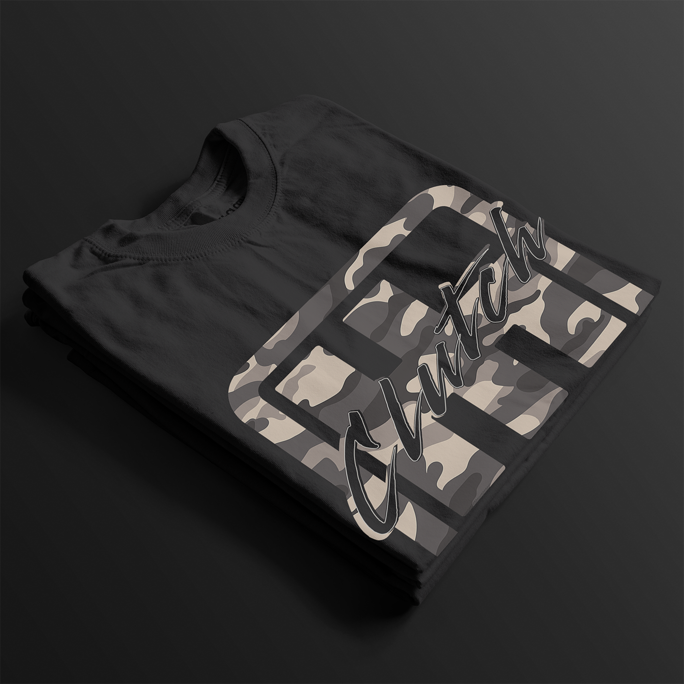 Clutch Clothing Camo Automotive Graphic T-Shirt – Folded view of black camo-patterned Clutch Clothing graphic tee. Ideal for car enthusiasts and streetwear lovers.