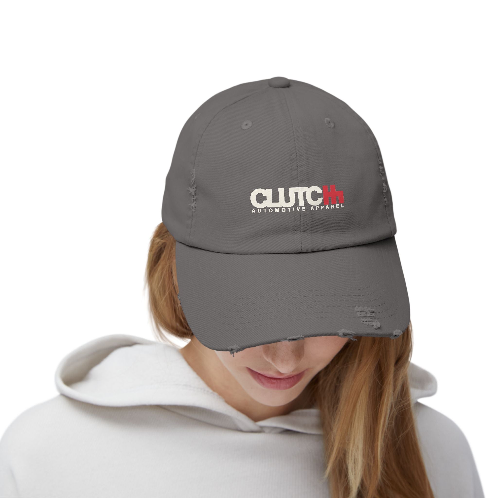 Woman wearing a Clutch 5 Panel Distressed Cap – Grey unisex distressed cap featuring the "CLUTCH" logo in cream and red embroidery. Made from durable cotton with a vintage, worn-in look. Adjustable fit for comfort and style — ideal for automotive and streetwear enthusiasts.