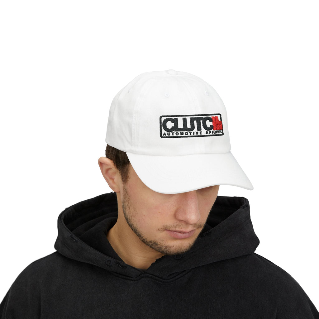 Man Wearing Clutch Automotive Apparel Embroidered Dad Cap – White unisex dad cap featuring the "CLUTCH" logo with red and black embroidery. Made from high-quality fabric, offering a comfortable and adjustable fit. Perfect for car lovers and automotive enthusiasts.
