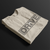 Folded Drive Automotive Graphic T-Shirt – Sand tee featuring bold "DRIVE" text with gear-inspired detailing. Perfect gift for car enthusiasts and racing fans.