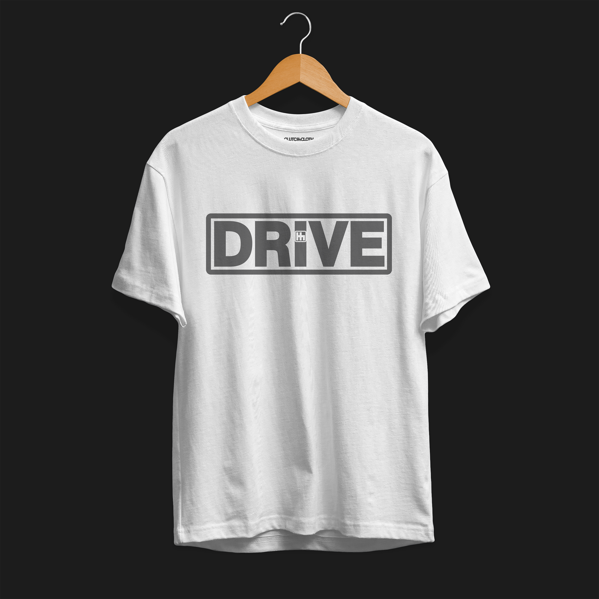 Front angle Drive Automotive Graphic T-Shirt – White tee featuring bold "DRIVE" text with gear-inspired detailing. Perfect gift for car enthusiasts and racing fans.