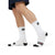 Man wearing Driving Lessons Crew Socks – White and black unisex crew socks featuring "GAS" and "CLUTCH" labels on the toes and heel. Comfortable and stylish, designed for automotive enthusiasts. Ideal gift or stocking stuffer for men and women who love cars and driving culture