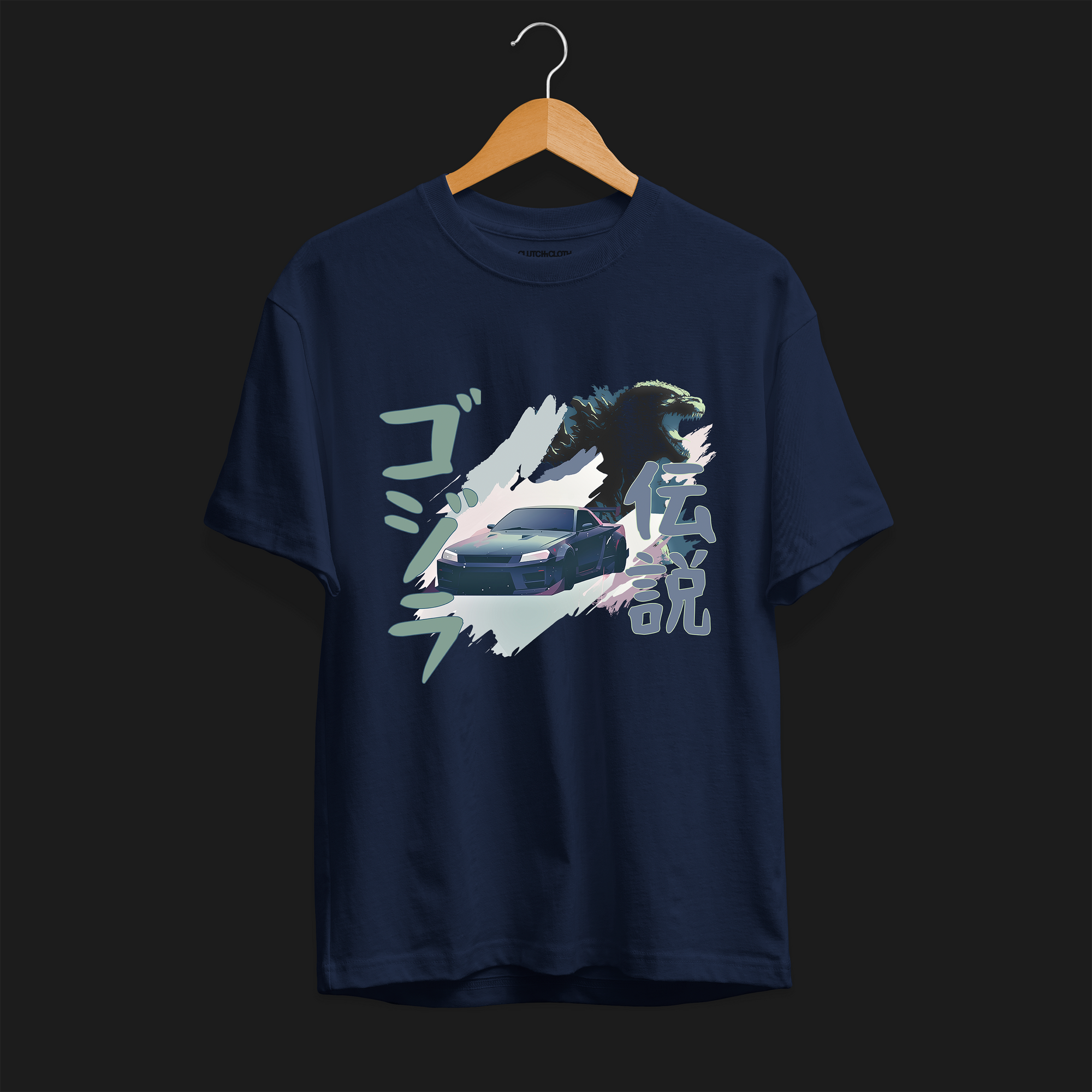 Front of Navy R34 Godzilla Legend Automotive Graphic T-Shirt featuring a Nissan Skyline GT-R with a Godzilla figure and Japanese text, unisex car enthusiast gift