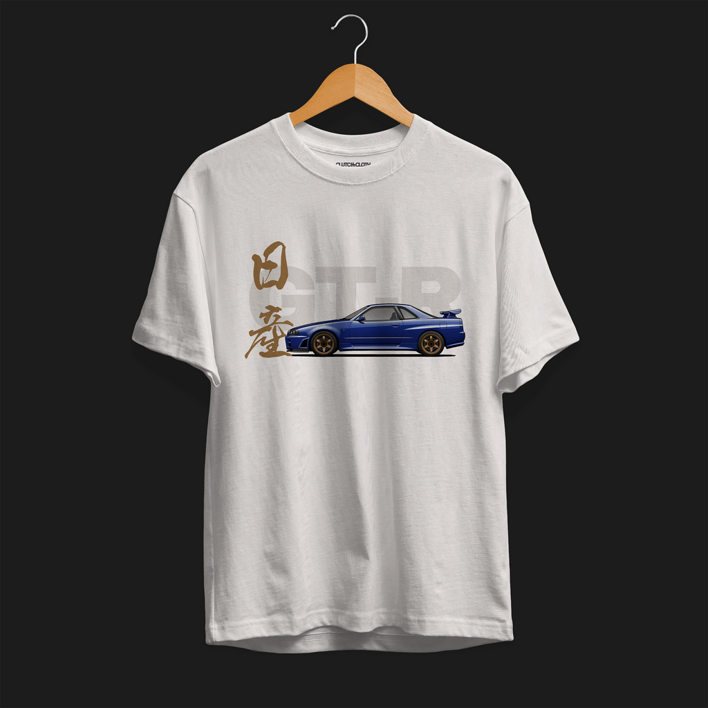 Front of White R34 GT-R Automotive Graphic T-Shirt featuring a blue Nissan Skyline with gold accents and Japanese calligraphy design, unisex car enthusiast gift