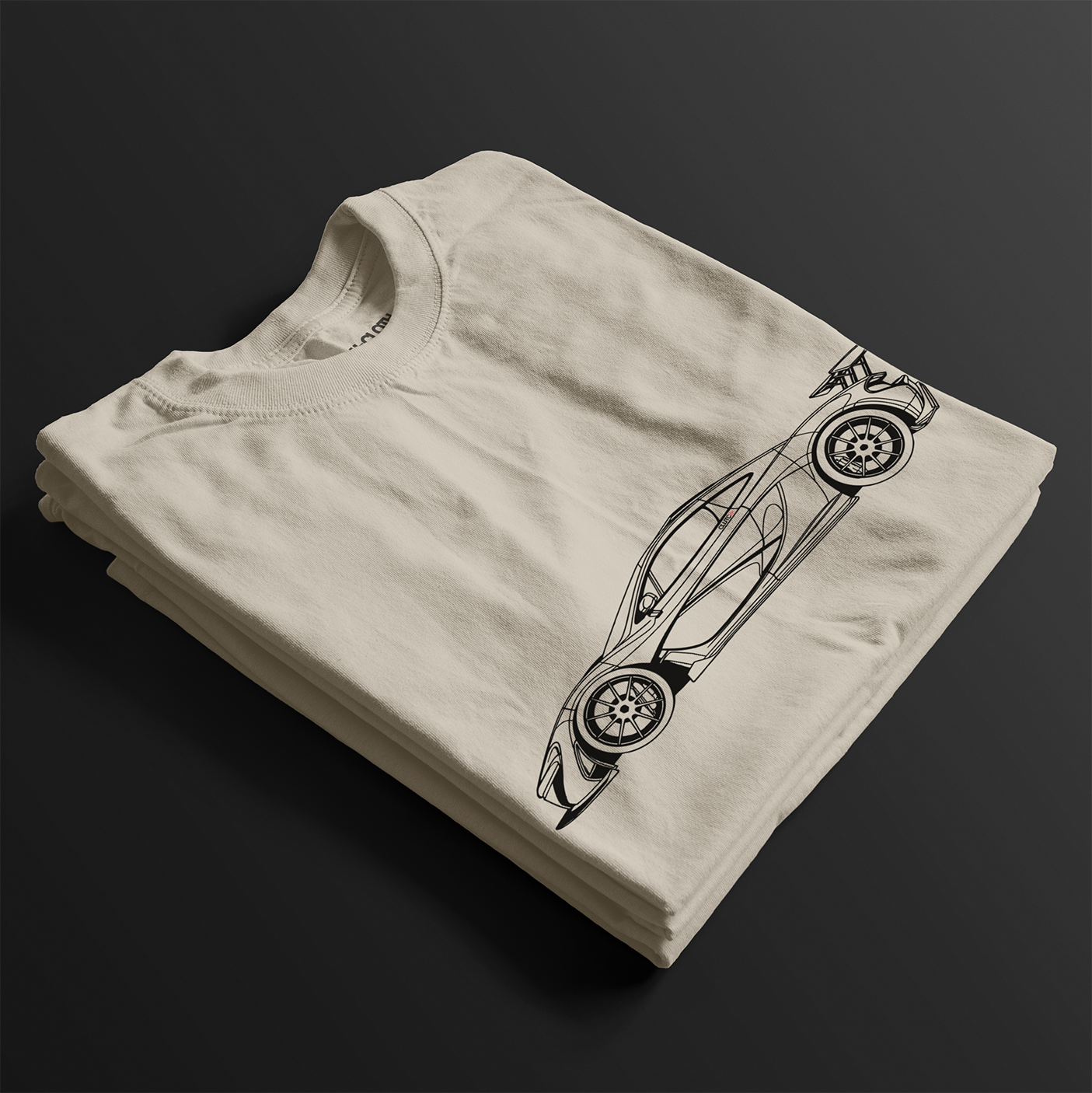 Folded P1 GTR Automotive Graphic T-Shirt – Beige unisex tee featuring a minimalist line art illustration of the P1 GTR supercar. A perfect gift for car enthusiasts and motorsport fans.