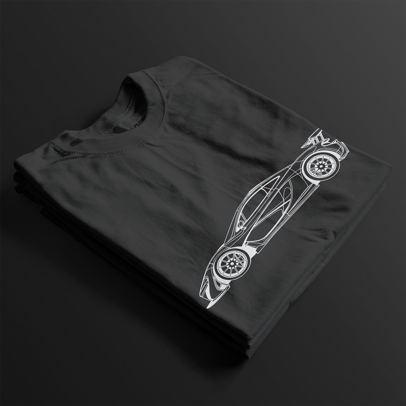 Folded P1 GTR Automotive Graphic T-Shirt – Black unisex tee featuring a minimalist line art illustration of the P1 GTR supercar. A perfect gift for car enthusiasts and motorsport fans.