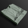 Folded P1 GTR Automotive Graphic T-Shirt – Sage green unisex tee featuring a minimalist line art illustration of the P1 GTR supercar. A perfect gift for car enthusiasts and motorsport fans.