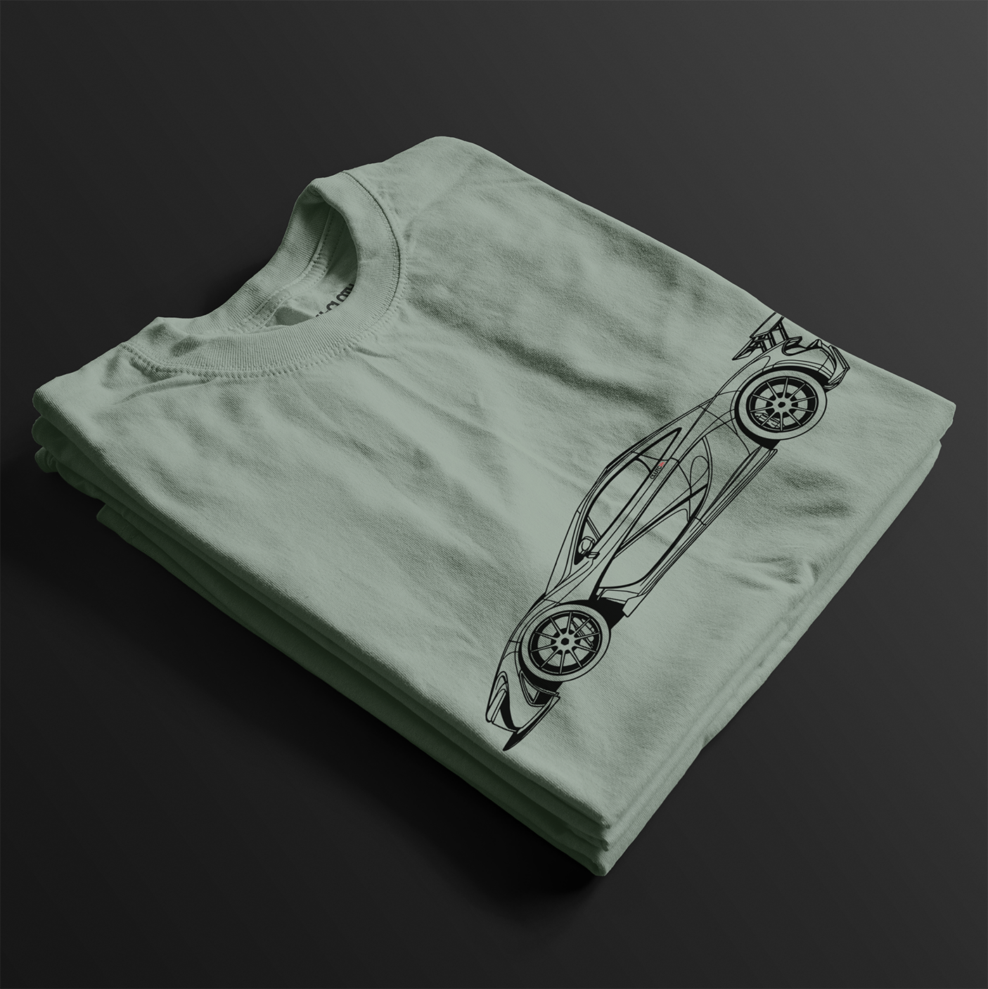 Folded P1 GTR Automotive Graphic T-Shirt – Sage green unisex tee featuring a minimalist line art illustration of the P1 GTR supercar. A perfect gift for car enthusiasts and motorsport fans.