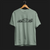 Front angle of P1 GTR Automotive Graphic T-Shirt – Sage green unisex tee featuring a minimalist line art illustration of the P1 GTR supercar. A perfect gift for car enthusiasts and motorsport fans.