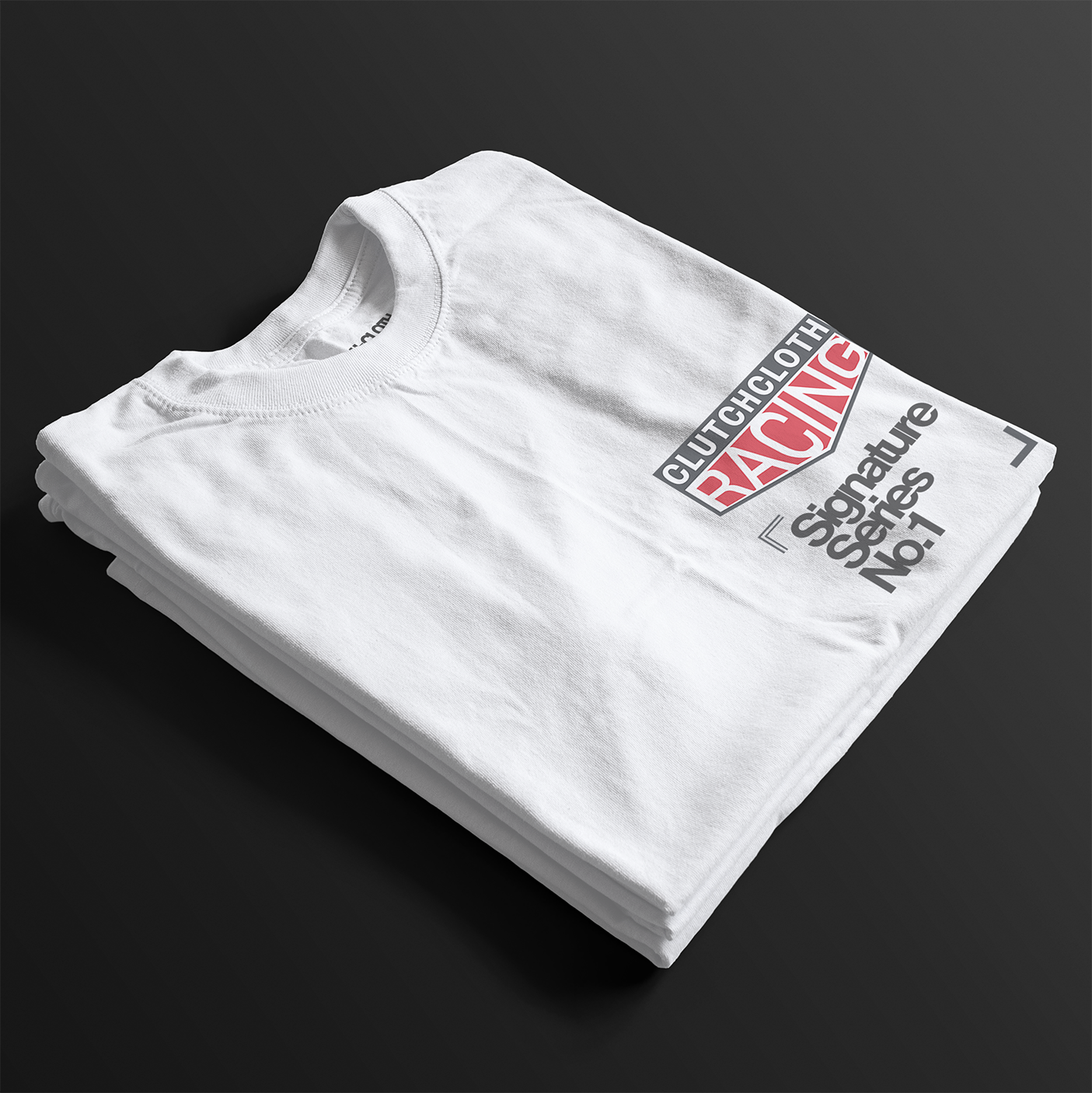 ClutchCloth Racing Signature Series No.1 Automotive Graphic T-Shirt – Folded White tee featuring a side-profile racing car design with red and black geometric accents. Ideal gift for motorsport enthusiasts and car culture fans.