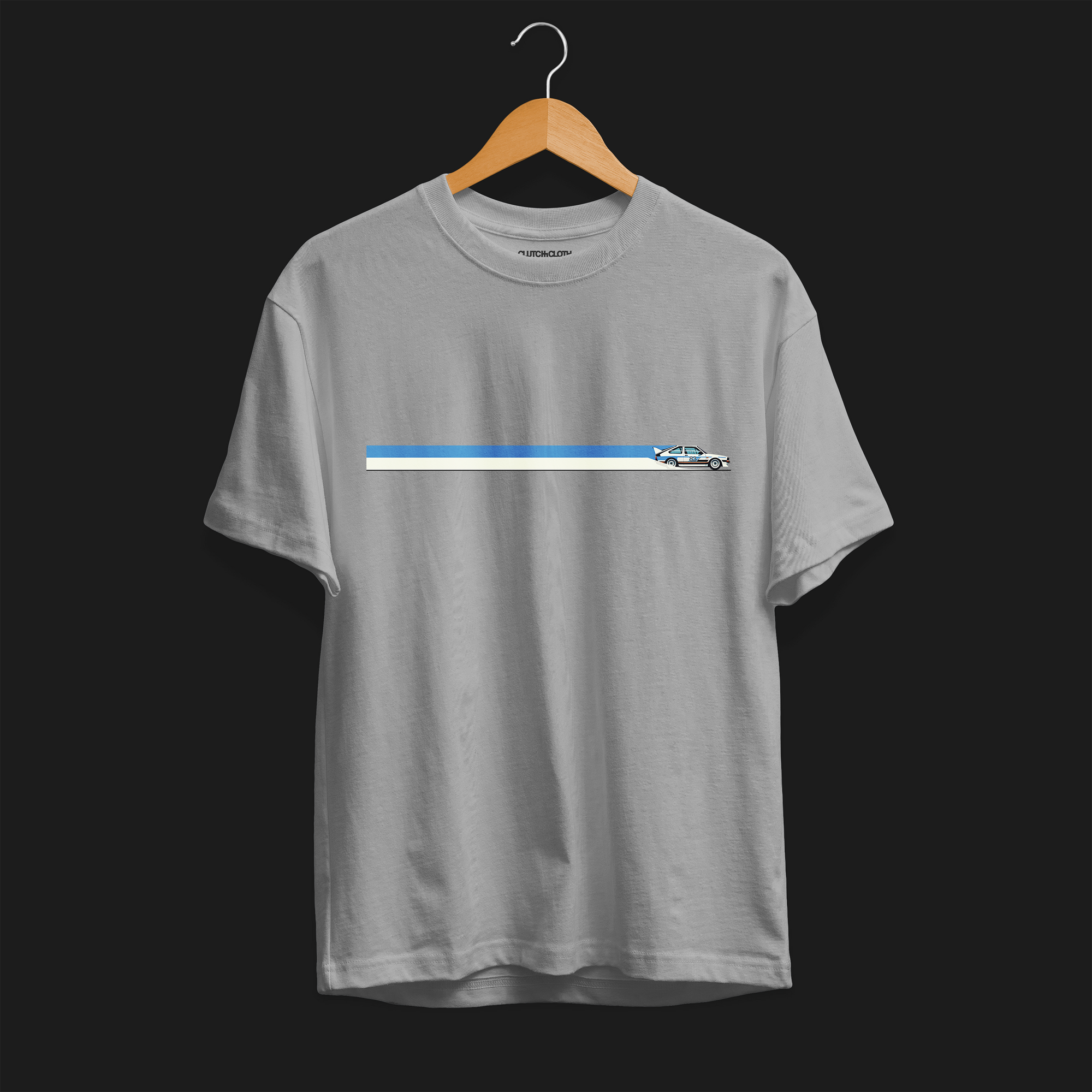 Front of CW Rally 83 Automotive Graphic T-Shirt – Sport Grey unisex tee with a minimalist rally car graphic and blue and grey racing stripes. Perfect gift for rally enthusiasts and motorsport lovers.