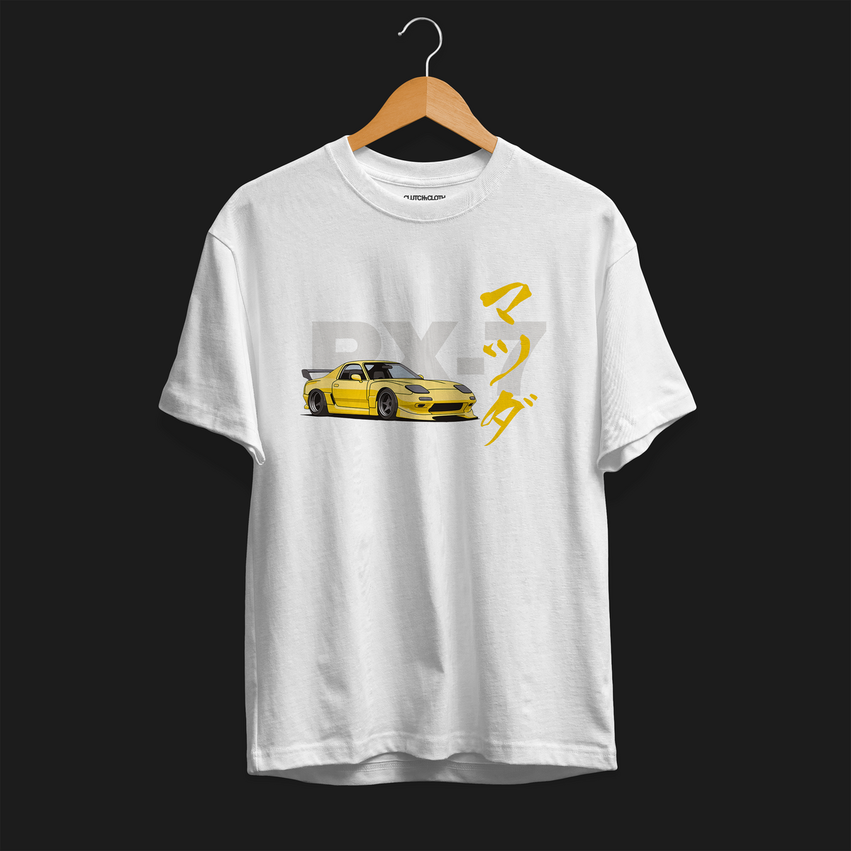 Front of white RX-7 Rotary Legend Automotive Graphic T-Shirt featuring a yellow Mazda RX-7 with Japanese text and RX-7 lettering, unisex car enthusiast gift