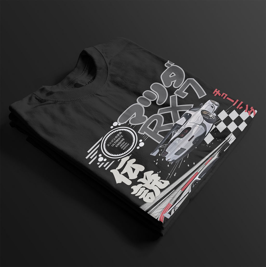 Folded Legendary Suzuka RX7 Automotive Graphic T-Shirt – Black tee featuring detailed RX7 graphics with Japanese lettering and racing elements. Perfect gift for JDM and car culture enthusiasts.