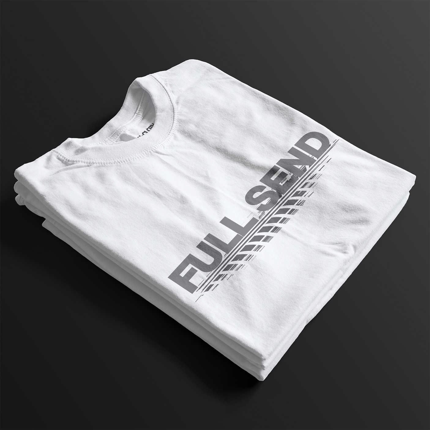 Folded Full Send Automotive Graphic T-Shirt – White tee featuring "FULL SEND" text with tire track detailing. Ideal gift for car lovers and motorsport fans.