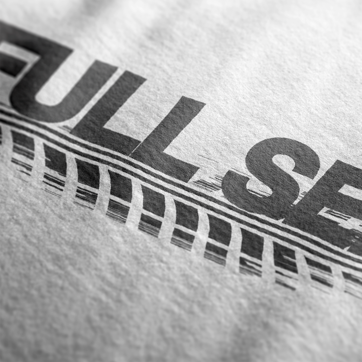 Design Close up of Full Send Automotive Graphic T-Shirt – White tee featuring "FULL SEND" text with tire track detailing. Ideal gift for car lovers and motorsport fans.