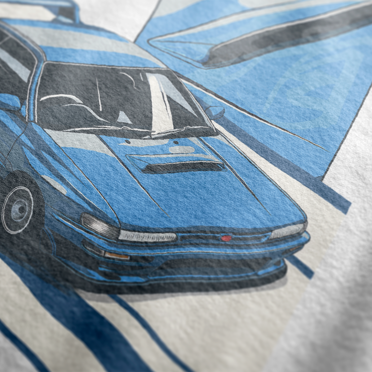 Close up of World Rally Pursuit of Excellence 22B Automotive Graphic T-Shirt Design – White unisex tee featuring a detailed blue Subaru 22B rally car graphic with racing-inspired elements. Ideal gift for Subaru fans and motorsport enthusiasts.