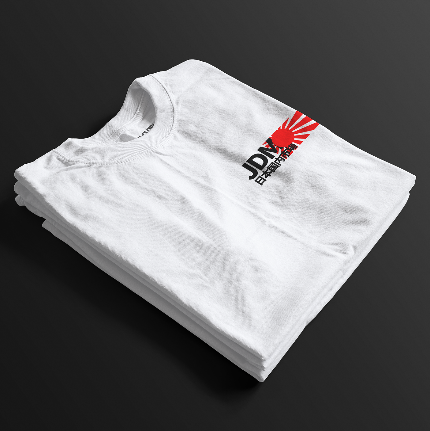 Folded White JDM Rising Sun Automotive Graphic T-Shirt with JDM text and a red rising sun graphic, unisex car culture gift