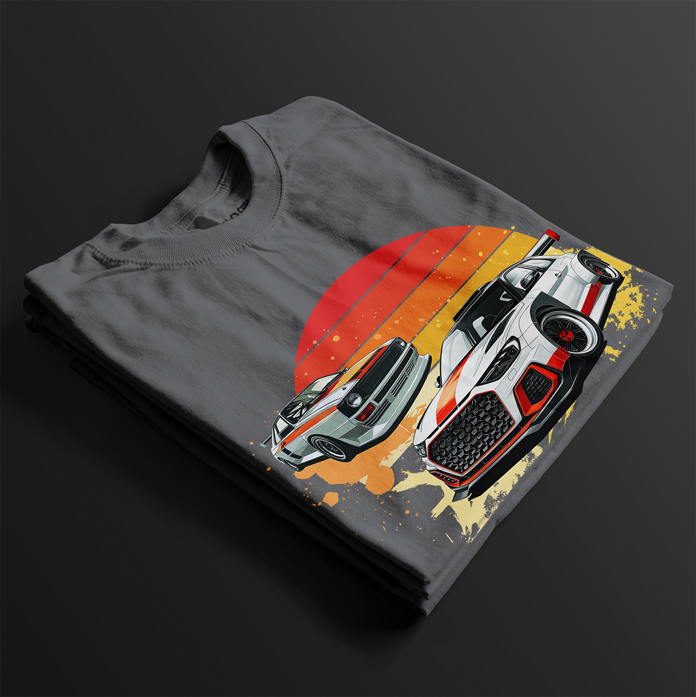 Folded Racing Sport Rally Sunset Automotive Graphic T-Shirt – Charcoal unisex tee featuring a rally car and a vintage car against a bold sunset background in shades of red, orange, and yellow. Ideal gift for car and motorsport enthusiasts.