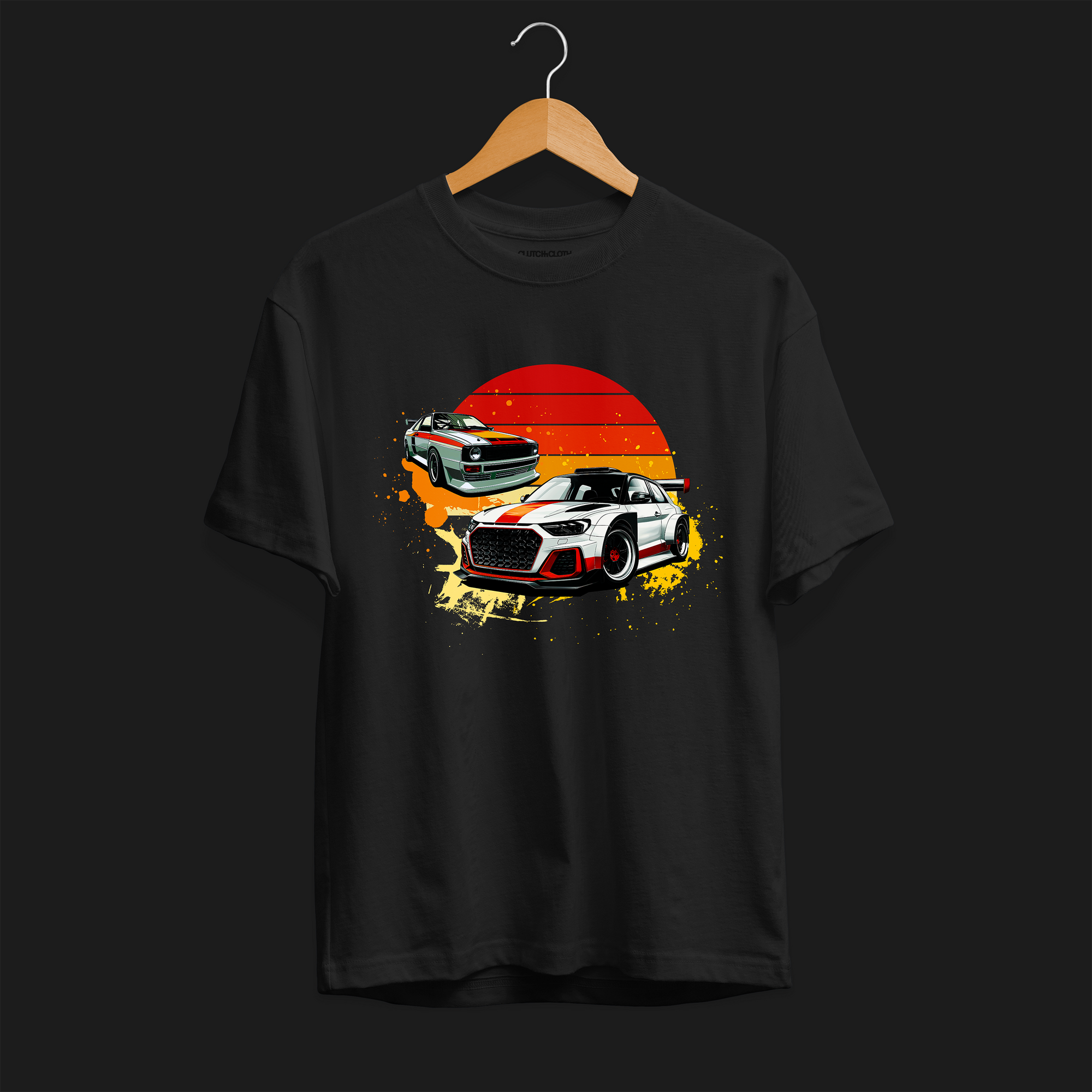 Front of Racing Sport Rally Sunset Automotive Graphic T-Shirt – Black unisex tee featuring a rally car and a vintage car against a bold sunset background in shades of red, orange, and yellow. Ideal gift for car and motorsport enthusiasts.